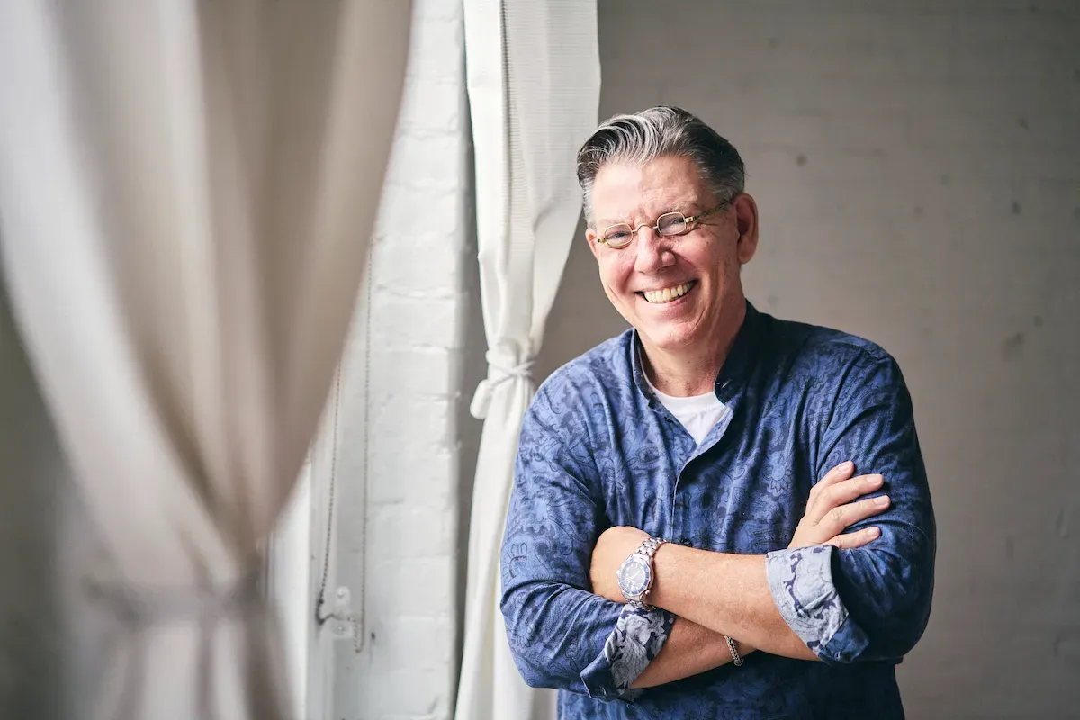 John Franklin Wiley laughing, arms crossed