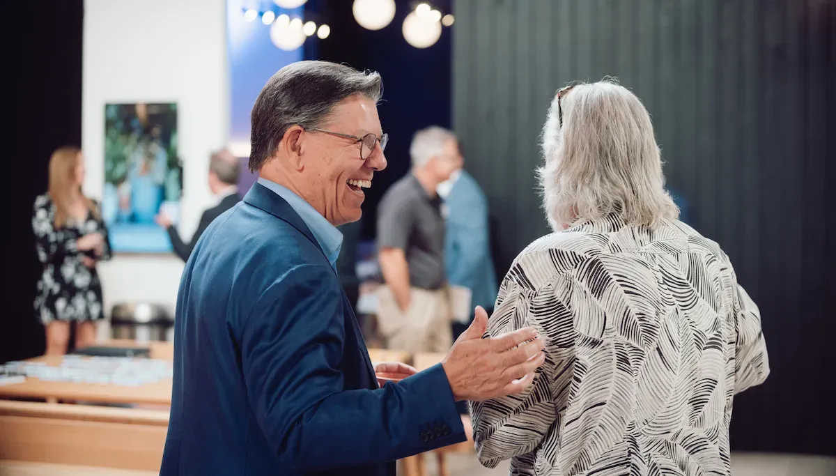 John Franklin Wiley greeting someone at an event
